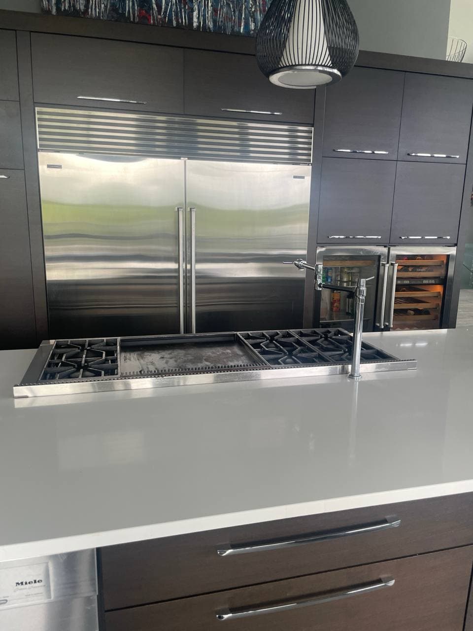 Kitchen island and Sub-Zero refrigerator